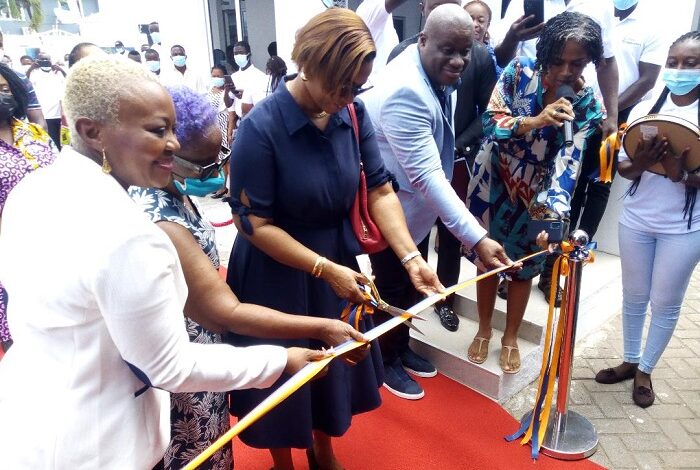 • Dr Yvonne Dei-Adomakoh (second from right) with Mrs Pamela Zormelo (in white) cutting the ribbon to officially open the laboratory