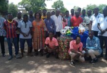• Mrs Babachuwey (4th left) with staff and old students after receiving the items