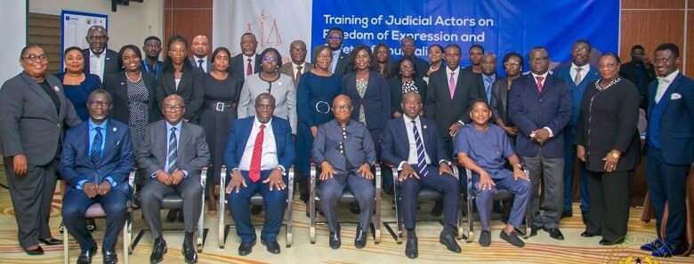 Mr Kojo Oppong Nkrumah (seated second from right) with judges and participants at the workshop