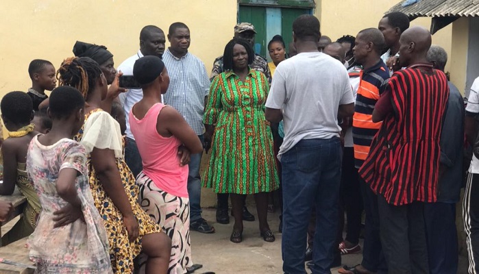 Prof. Opoku-Agyemang (middle) interacting with victims of the flood