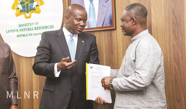 Mr Jinapor handing over one of the licences to an official of the Association