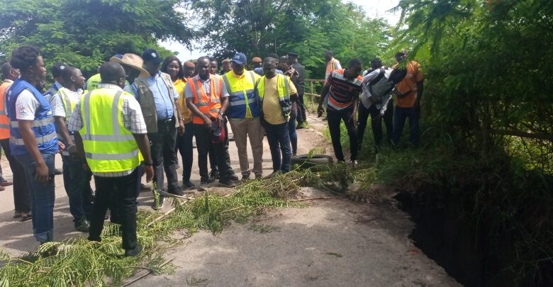 • Mr Kwasi Amoako-Atta inspecting some of portion the damaged roads