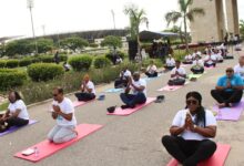 Mr Sugandh Rajaram (middle) with other participants during the Yoga exercise. Photo. Ebo Gorman