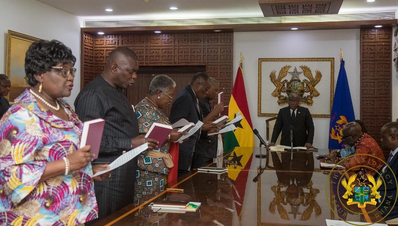 President Akufo-Addo (right) swearing in the members
