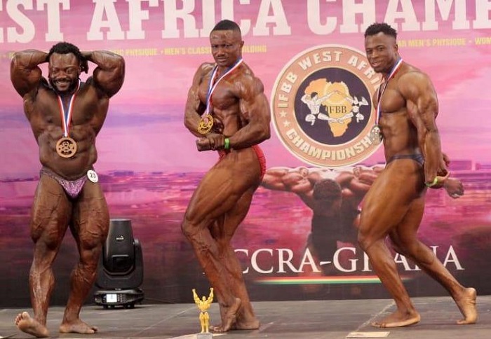 • Evans Amwagsi (middle) in a pose with other competitors after receiving his trophy