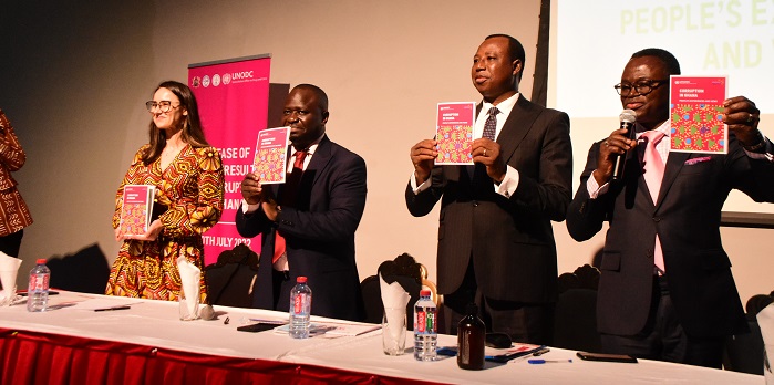 Justice Emmanuel Yonny Kulendi (right) and other digintaries launching the report