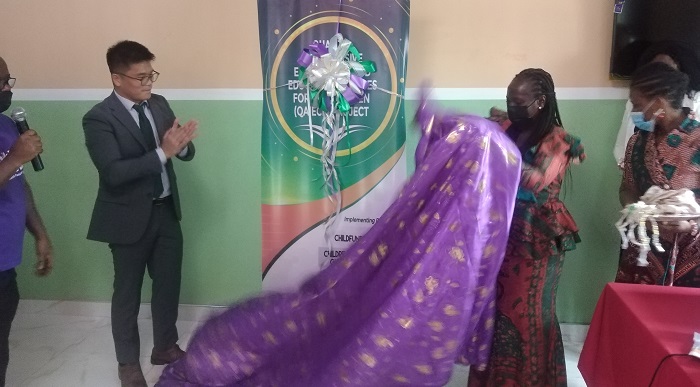 • Mr BoSung Jeang, Deputy Country Director for KOICA (left), and Madam Vida Barbara Ntow, National Director of ECE (right), unveiling the project.