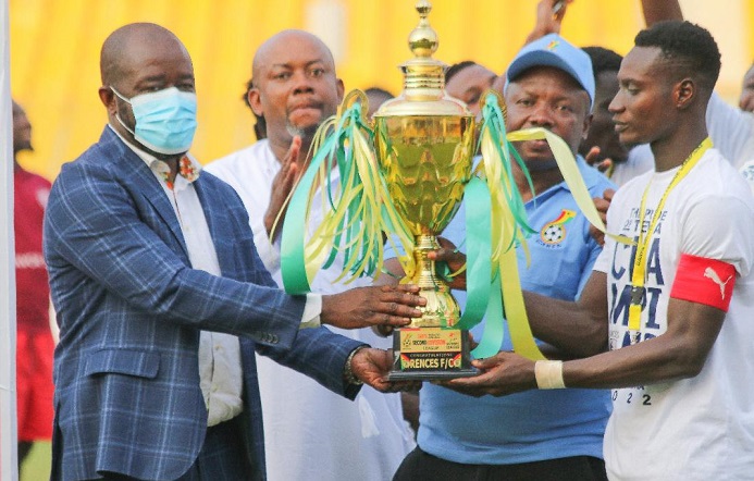 • FA President Kurt Okraku (left) presents the trophy to Rences FC captain while FA ExCo member Samuel Anim Addo and GARFA boss Samuel Aboabire look on Photo: Raymond Ackumey