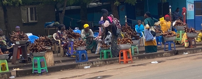 • Hawkers seated idly behind their wares