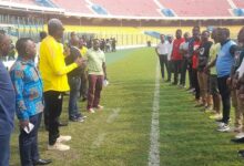 Head of the Civil Service, Nana Kwasi Agyemang-Dwamena (fourth left) interacting with captains of the teams ahead of kick off