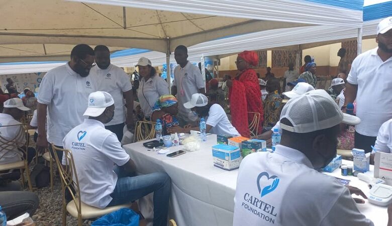 • Dr Vanderpuye (standing left) with Mr Owoo (standing second left) with other dignitaries observing the health screening.
