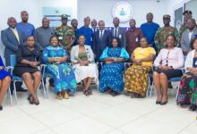 • Mrs Owusu-Ekuful (seated fourth from left) with the committee members