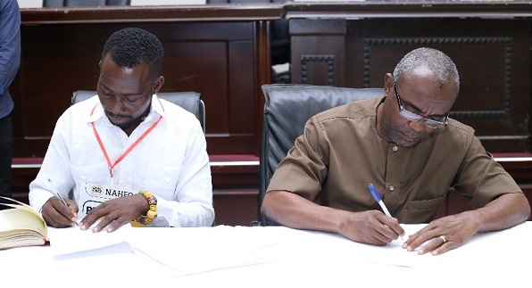 • Mr Eyiah (left) and Dr. Jethro Wilbert Brooks signing the Memoradum of Understanding