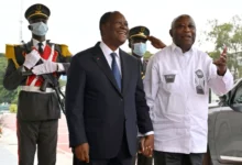 Cote d'Ivoire President Ouattara (right) poses with Mr Gbagbo at the presidential palace in Abidjan