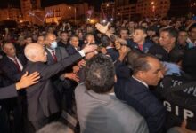 President Saied celebrates with his supporters after Monday's vote