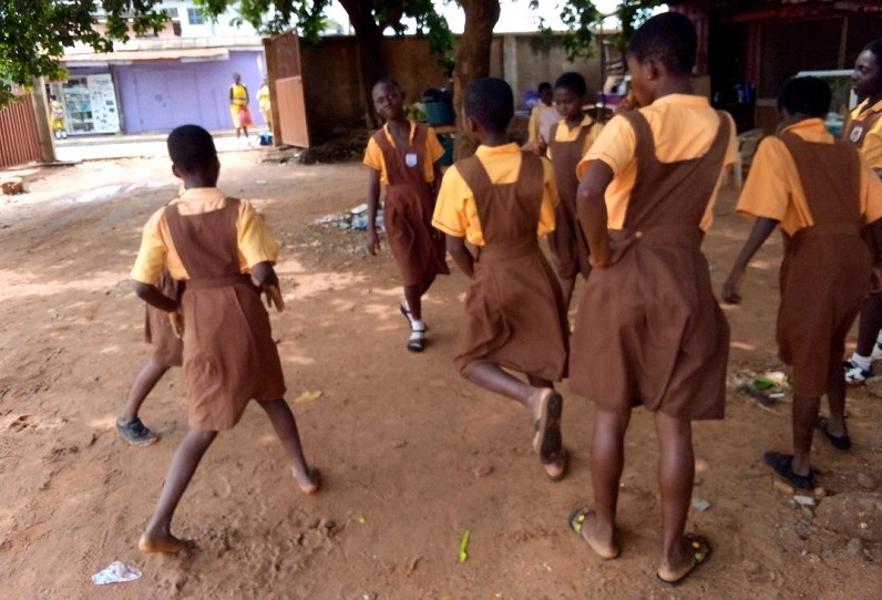 Pupils of Kaneshie 3 Basic primary playing at the school compound