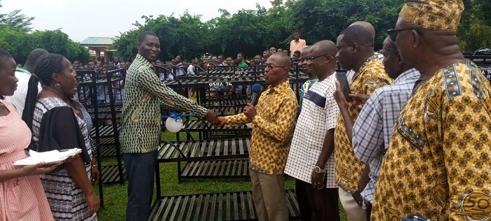 • Mr David Seshie(fifth from right) presenting the beds to the Headmaster