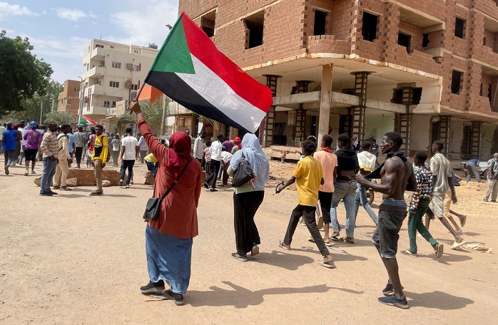 Protesters march through the capital Khartoum during a rally against the country's military leadership