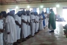 • Rev Fr Awafo leading the family and sympathisers in a prayer
