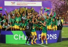 • The South African women celebrate with the trophy