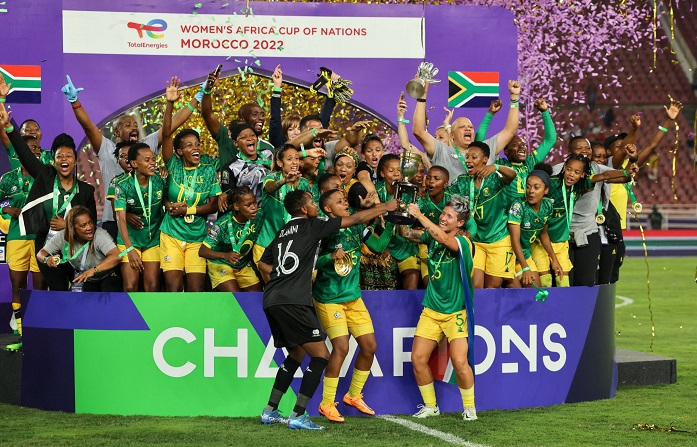 • The South African women celebrate with the trophy