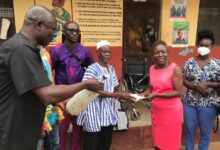 • Mr Mosongo (left) and a representative of the chief of Jang, handing over the items to Ms Balagumyetime