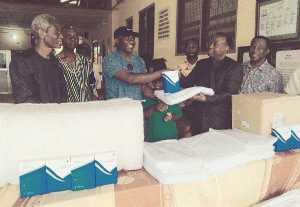 • Mr Stephen Agbo (third from left) presenting the items to Pastor Dr Arloo some of the hospital staff look on