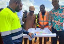 Mr Benito Owusu-Bio (second from left) and other officials viewing the plan for the project