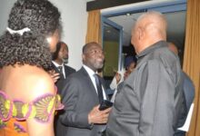 • Mr Quiosa (middle) in a chat with other dignitaries after the programme Photo Victor A Buxton