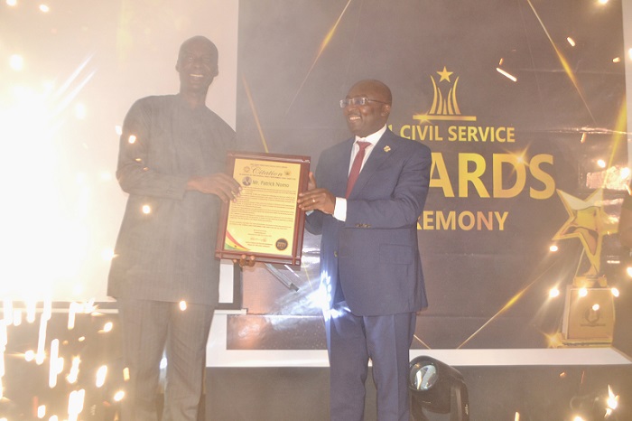• Mr Patrick Nomo (left) receiving the overall best performing Chief Director of the year award from Dr Mahamudu Bawumia