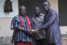 • Mr Kofi Ofori (right) presenting cash and schnapps to Odorkor Asafoatse Okudzeman III