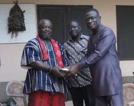 • Mr Kofi Ofori (right) presenting cash and schnapps to Odorkor Asafoatse Okudzeman III
