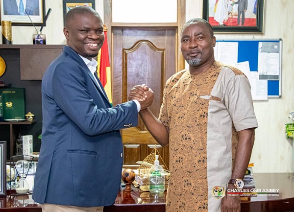 • Mr Osei Asibey (left) and the Sports Minister exchanging pleasantries during the visit