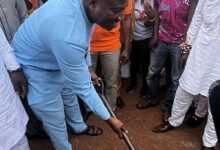 Mr Ibrahim Murtala Mohammed cutting sod for the start of the project