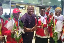 • Coach Asare (right) joined by four athletes – from left: Deborah, Mensah, Omar, Commey and GBA President Abraham Kotey (third right) shortly on arrival yesterday