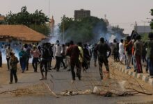 Protesters march during a rally against military rule following the last coup, in Khartoum, Sudan
