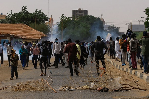 Protesters march during a rally against military rule following the last coup, in Khartoum, Sudan