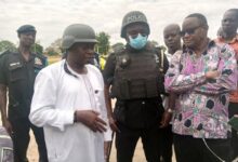 Mr Stephen Yakubu(left), DCOP Dr. Sayibu Gariba (middle) and other officials during their visit to the school