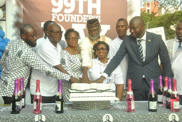 • Mr Osei Bonsu Dickson second (right) being assisted by Madam Evelyn Nabia and other dignitaries to cut the cake Photo: Lizzy Okai