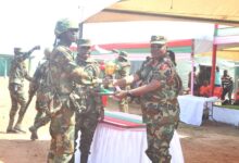 • Brigadier General Michael Ayisi Amoah (right) presenting the overall best team award to a r epresentative from 2BN Photo: Victor A. Buxton