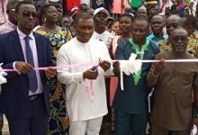 Mr Duker (middle) joined by Mr Darko-Mensah( in suit) and headmaster, Mr Saighoe (second rt) and MCE,BenKesse to cut the tape for the inauguration of the new boys’ dormitory at Fiaseman,
