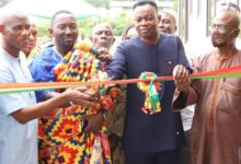 Nene Tetteh (second from left) cutting the tape to signal the opening of the facilities