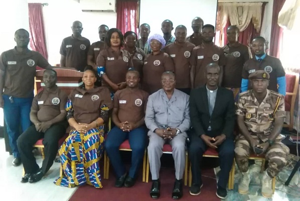 ADP Hayibor (seated 3rd right) and C/Inspector Rev. Kumatror (2nd right) and the SDA Prison Evangelists.