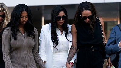 Vanessa Bryant (centre), with her daughter Natalia (left) and footballer Sydney Leroux leaving the court