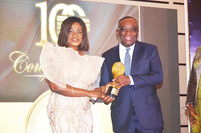 • Mr Kwesi Agyemang Busia, CEO of DVLA (right)receiving his award from Dr Irene Stella Agyenim-Boateng