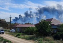 Smoke rises after explosions were heard from the direction of a Russian military airbase near Novofedorivka