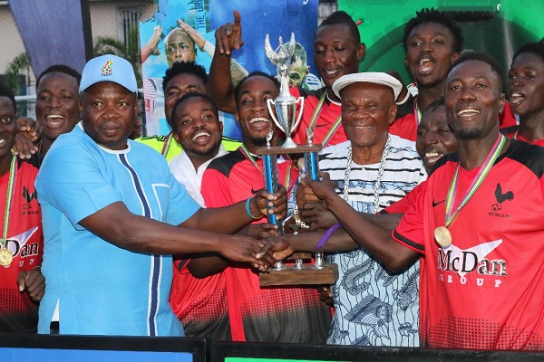 • Samuel Aboabire, Chairman of the Greater Accra Football Association (GARFA) (left) joined by Nii Kakalor Oshila Commieteh, Homowo Planning Committee Chairman, to present the trophy to La Town XI
