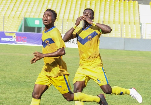 • Mensah (left) joined by his skipper Collins Amoah Boateng to celebrate the lone goal