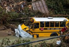 A school bus sits in a creek following heavy rains near the city of Jackson