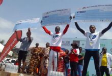 • Kenya’s Tirop (centre) flanked by Atia (left) and Tumuti displacing their prizes after the race